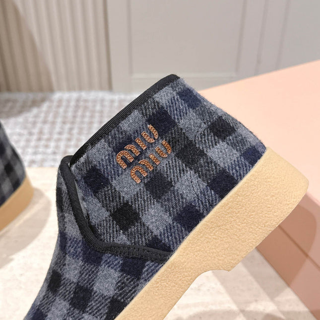 MIUMIU 25S SLIP-ON BOOTIES IN BLACK AND BLUE WOOL WITH SHEARLING