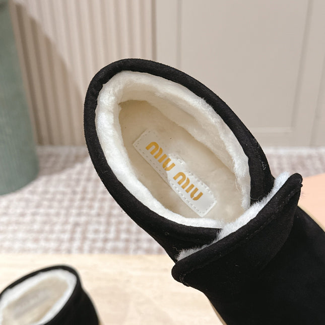 MIUMIU 25S SLIP-ON BOOTIES IN BLACK SUEDE WITH FAUX SHEARLING