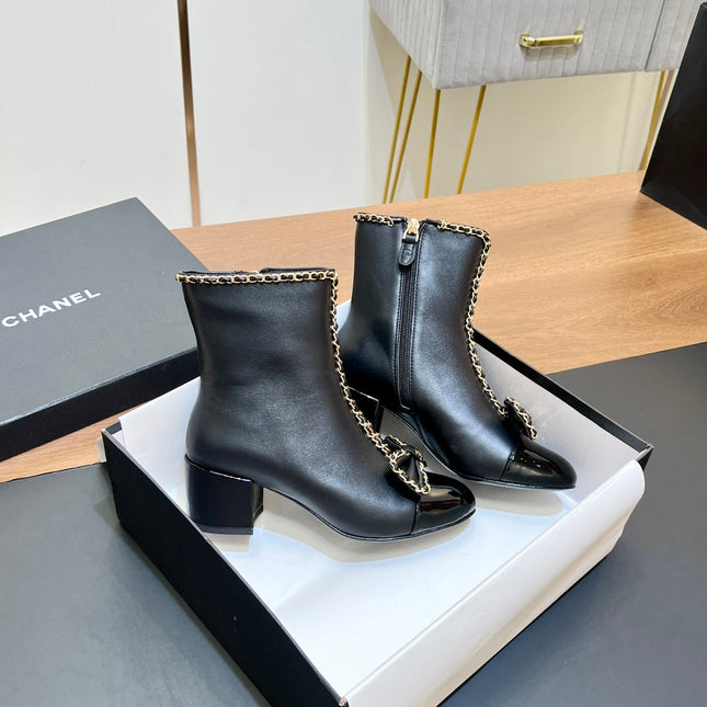 CHANEL 25S HEELED CHAIN BOOTS WITH BOW IN BLACK CALFSKIN GOLD HARDWARE