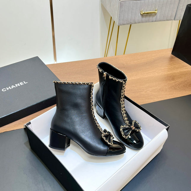 CHANEL 25S HEELED CHAIN BOOTS WITH BOW IN BLACK CALFSKIN GOLD HARDWARE