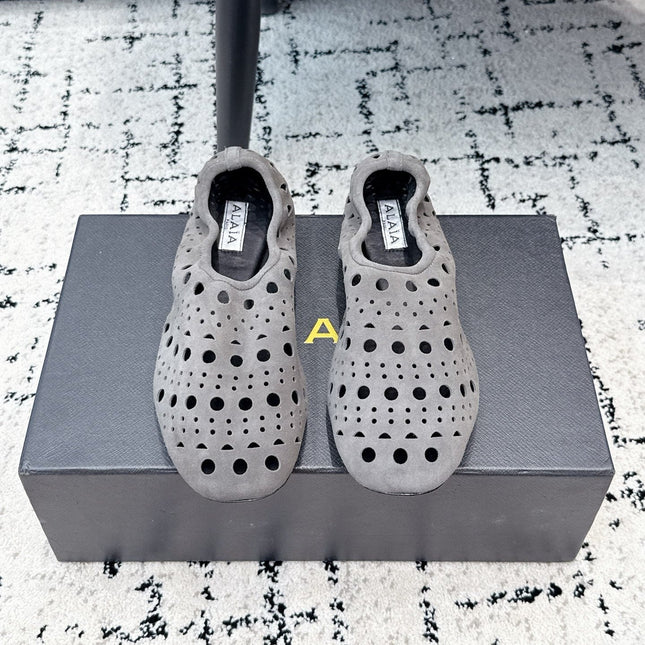 ALAIA 26S FLAT SLIP-ONS IN GREY SUEDE WITH OPENWORK PATTERN