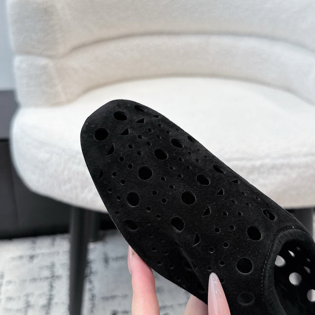 ALAIA 26S FLAT SLIP-ONS IN BLACK SUEDE WITH OPENWORK PATTERN