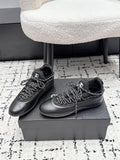 CHANEL 26S LACE-UP SNEAKERS IN BLACK FABRIC AND LAMBSKIN