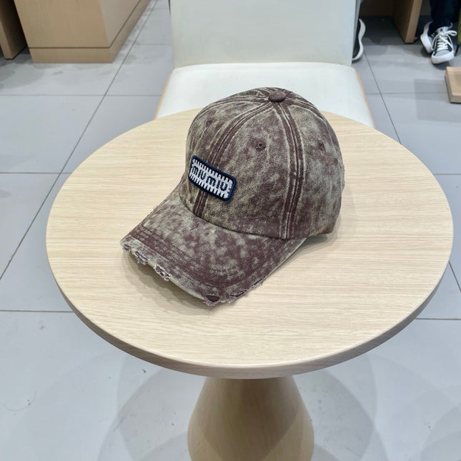 MIUMIU DISTRESSED FABRIC BASEBALL CAP IN BROWN WITH EMBROIDERED LOGO