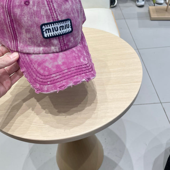 MIUMIU DISTRESSED FABRIC BASEBALL CAP IN PINK WITH EMBROIDERED LOGO