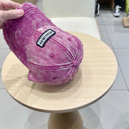MIUMIU DISTRESSED FABRIC BASEBALL CAP IN PINK WITH EMBROIDERED LOGO