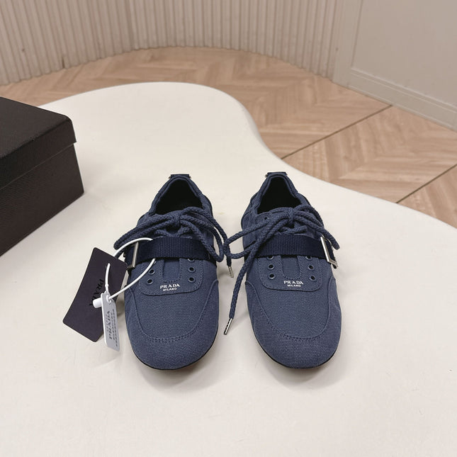 PRADA 26S LACE UP MINIMAL SNEAKERS IN NAVY BLUE CANVAS
