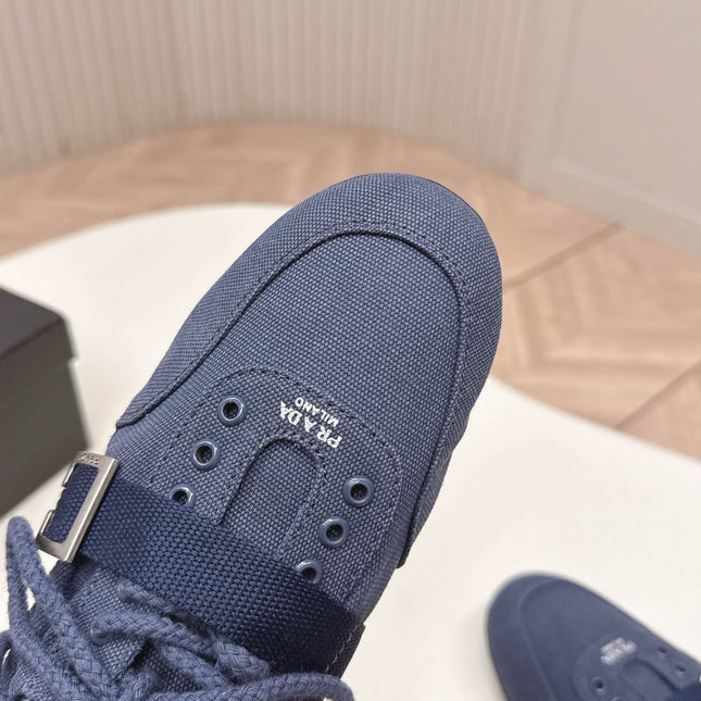 PRADA 26S LACE UP MINIMAL SNEAKERS IN NAVY BLUE CANVAS