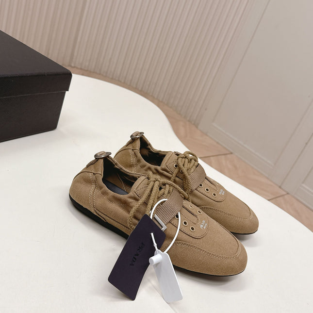 PRADA 26S LACE UP MINIMAL SNEAKERS IN BROWN CANVAS