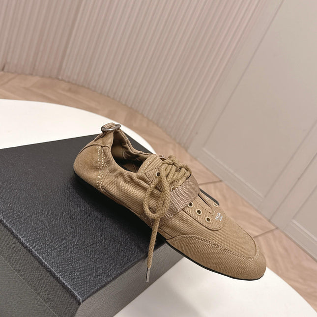 PRADA 26S LACE UP MINIMAL SNEAKERS IN BROWN CANVAS