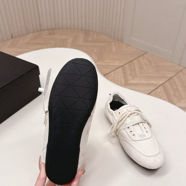 PRADA 26S LACE UP MINIMAL SNEAKERS IN WHITE CANVAS