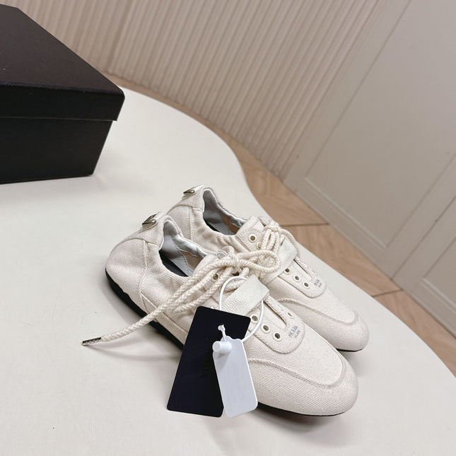 PRADA 26S LACE UP MINIMAL SNEAKERS IN WHITE CANVAS