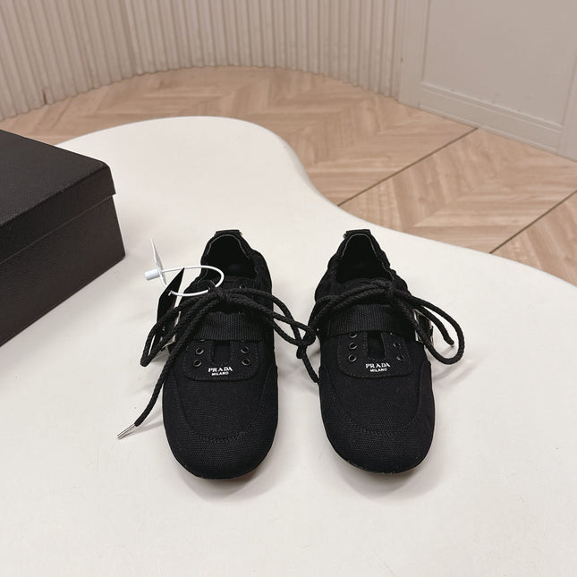 PRADA 26S LACE UP MINIMAL SNEAKERS IN BLACK CANVAS