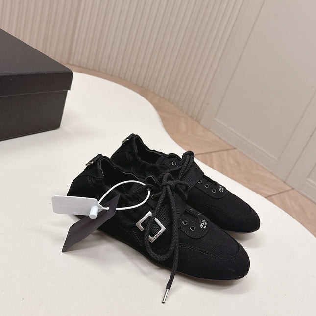 PRADA 26S LACE UP MINIMAL SNEAKERS IN BLACK CANVAS