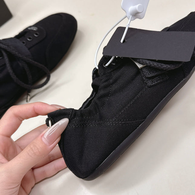 PRADA 26S LACE UP MINIMAL SNEAKERS IN BLACK CANVAS