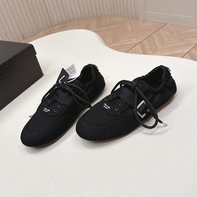 PRADA 26S LACE UP MINIMAL SNEAKERS IN BLACK CANVAS
