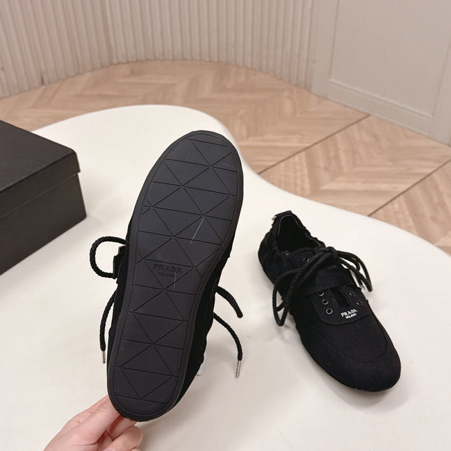 PRADA 26S LACE UP MINIMAL SNEAKERS IN BLACK CANVAS