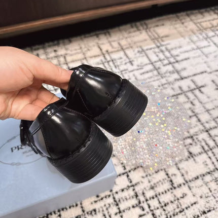 PRADA 26S BUCKLED LOAFERS IN BLACK SHINY CALFSKIN
