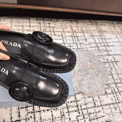 PRADA 26S BUCKLED LOAFERS IN BLACK SHINY CALFSKIN