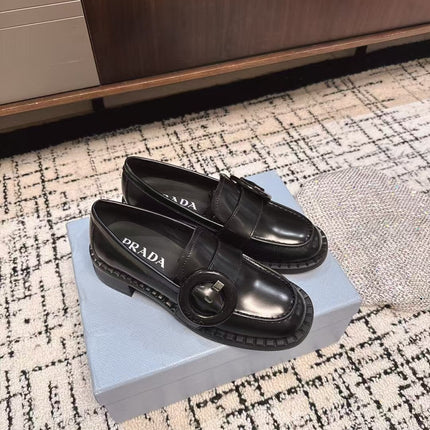 PRADA 26S BUCKLED LOAFERS IN BLACK SHINY CALFSKIN