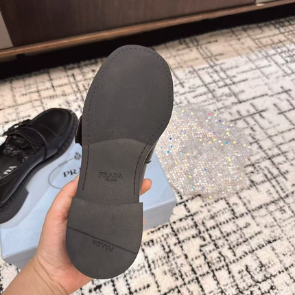 PRADA 26S BUCKLED LOAFERS IN BLACK SHINY CALFSKIN