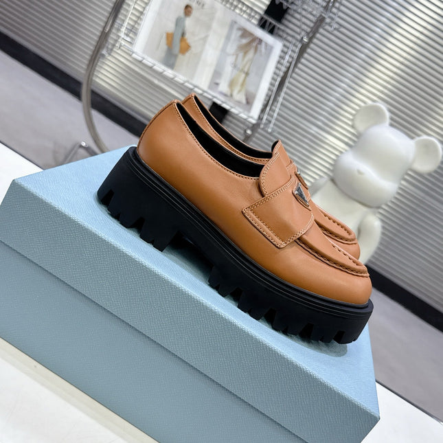 PRADA 25S THICK-SOLE LOAFERS 60 MM IN COGNAC BROWN CALFSKIN