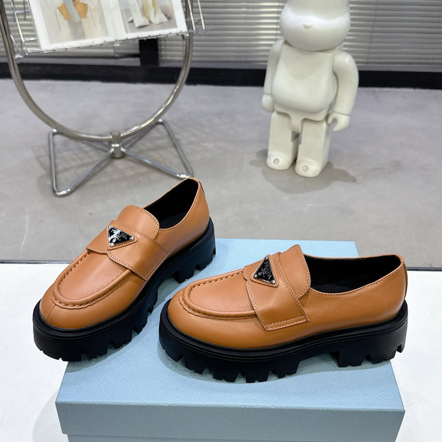 PRADA 25S THICK-SOLE LOAFERS 60 MM IN COGNAC BROWN CALFSKIN