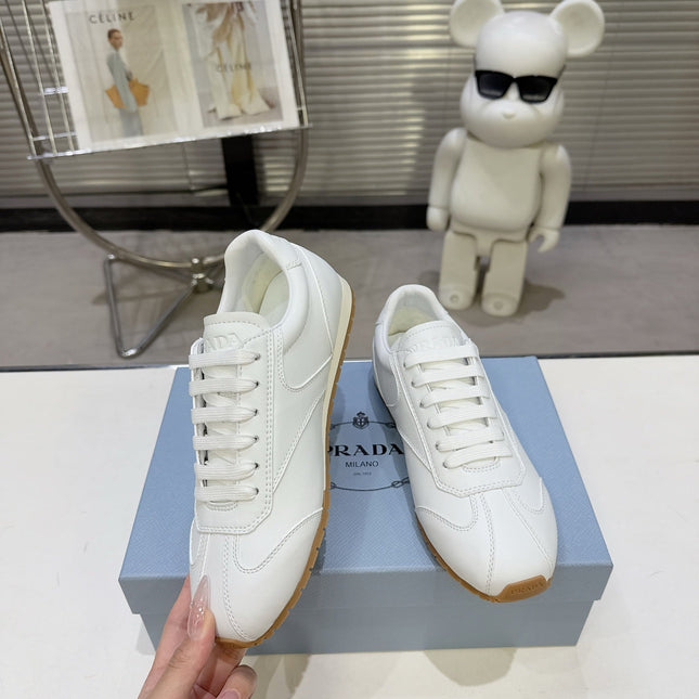 PRADA 26S LACE UP SNEAKERS IN WHITE CALFSKIN