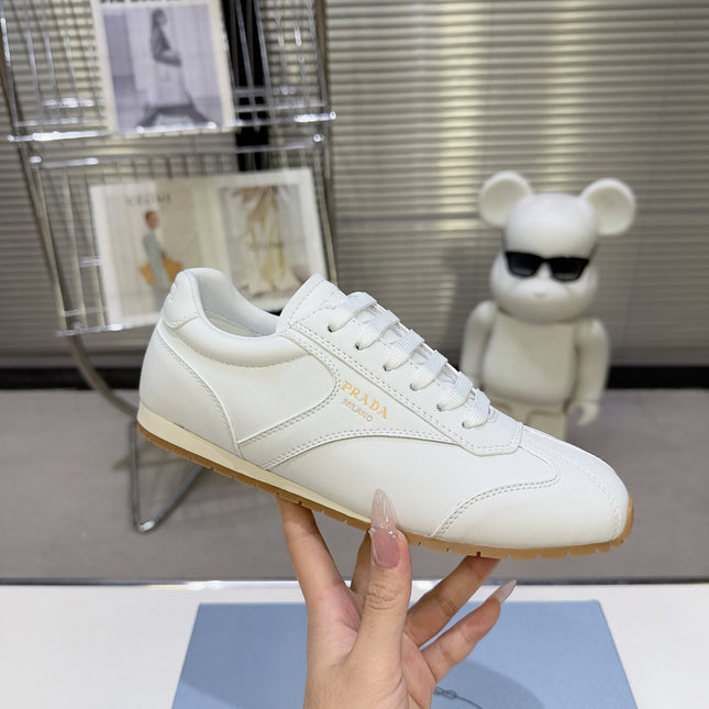 PRADA 26S LACE UP SNEAKERS IN WHITE CALFSKIN
