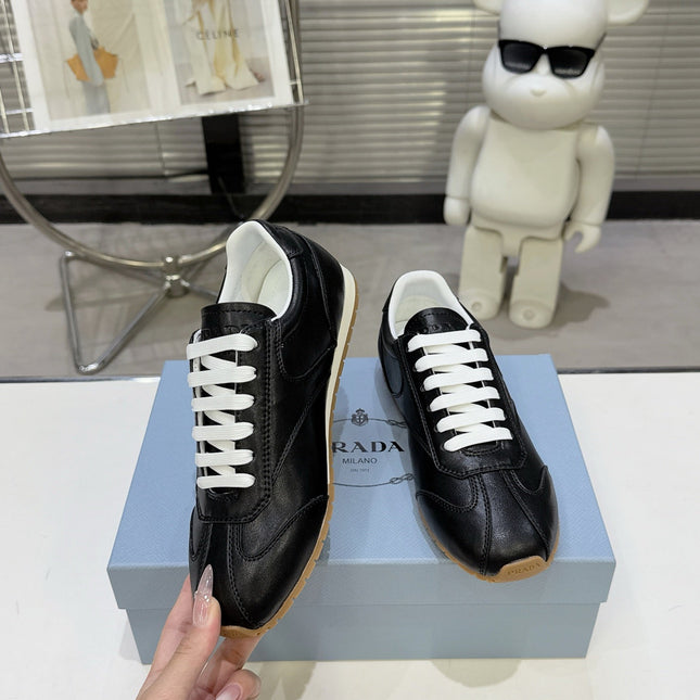 PRADA 26S LACE UP SNEAKERS IN BLACK CALFSKIN