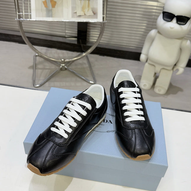 PRADA 26S LACE UP SNEAKERS IN BLACK CALFSKIN