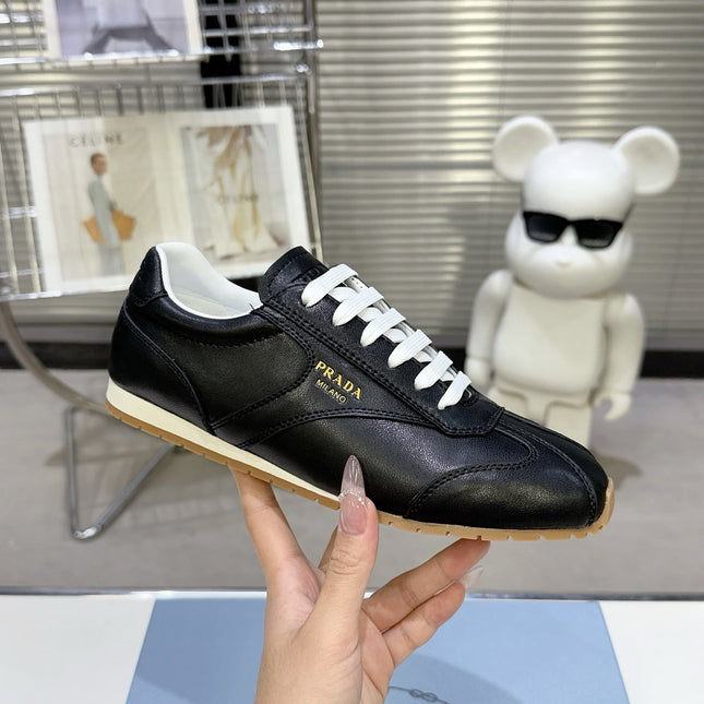 PRADA 26S LACE UP SNEAKERS IN BLACK CALFSKIN