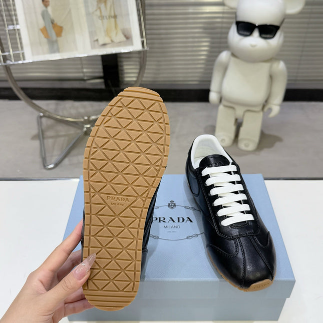 PRADA 26S LACE UP SNEAKERS IN BLACK CALFSKIN