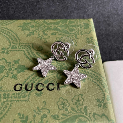 GUCCI 26S DOUBLE G STAR CRYSTAL DROP EARRINGS IN SILVER TONE METAL 627016