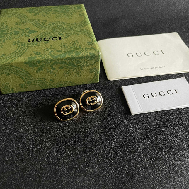 GUCCI 26S INTERLOCKING G ROUND LOGO STUD EARRINGS IN BLACK ENAMEL & GOLD TONE METAL 625716