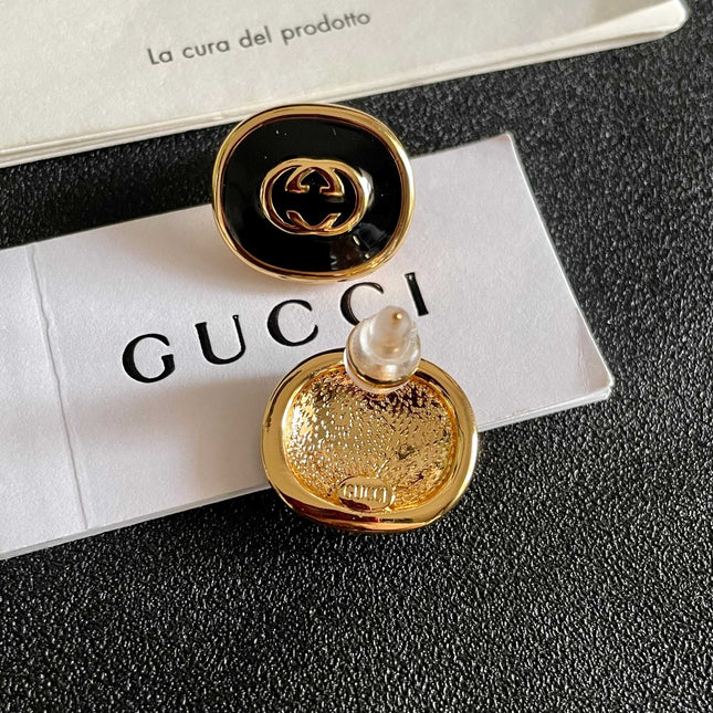 GUCCI 26S INTERLOCKING G ROUND LOGO STUD EARRINGS IN BLACK ENAMEL & GOLD TONE METAL 625716