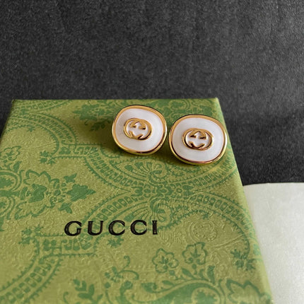 GUCCI 26S INTERLOCKING G ROUND LOGO STUD EARRINGS IN WHITE ENAMEL & GOLD TONE METAL 625717