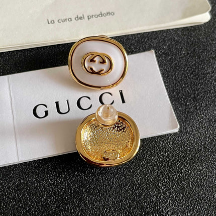 GUCCI 26S INTERLOCKING G ROUND LOGO STUD EARRINGS IN WHITE ENAMEL & GOLD TONE METAL 625717