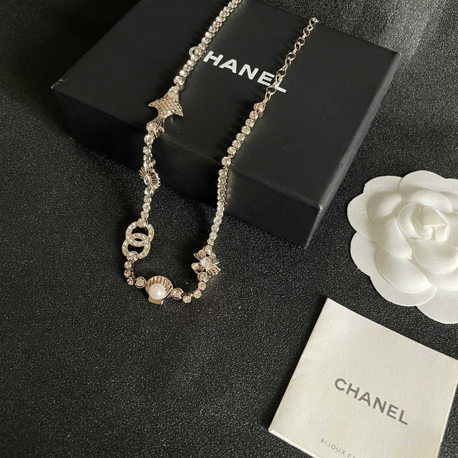 CHANEL 26S DOUBLE C LOGO CRYSTAL MULTI-CHARM STATEMENT BRACELET IN GOLD METAL 629170