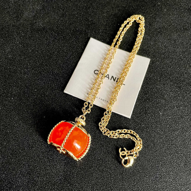 CHANEL 26S DOUBLE C LOGO ORANGE RESIN STATEMENT PENDANT NECKLACE IN GOLD METAL 629172