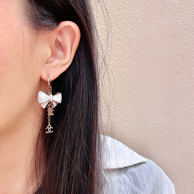CHANEL 26S DOUBLE C LOGO WHITE ENAMEL BOW & CHAIN DROP HOOP EARRINGS IN GOLD METAL 629182