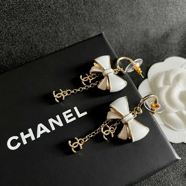 CHANEL 26S DOUBLE C LOGO WHITE ENAMEL BOW & CHAIN DROP HOOP EARRINGS IN GOLD METAL 629182