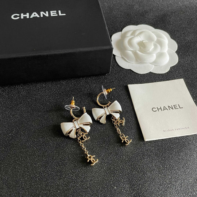 CHANEL 26S DOUBLE C LOGO WHITE ENAMEL BOW & CHAIN DROP HOOP EARRINGS IN GOLD METAL 629182