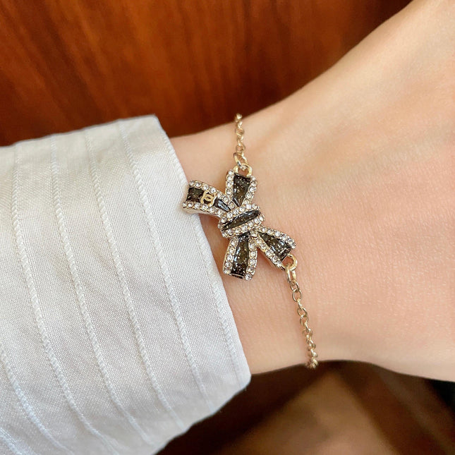 CHANEL 26S CRYSTAL BOW CHAIN BRACELET IN GOLD METAL 629980
