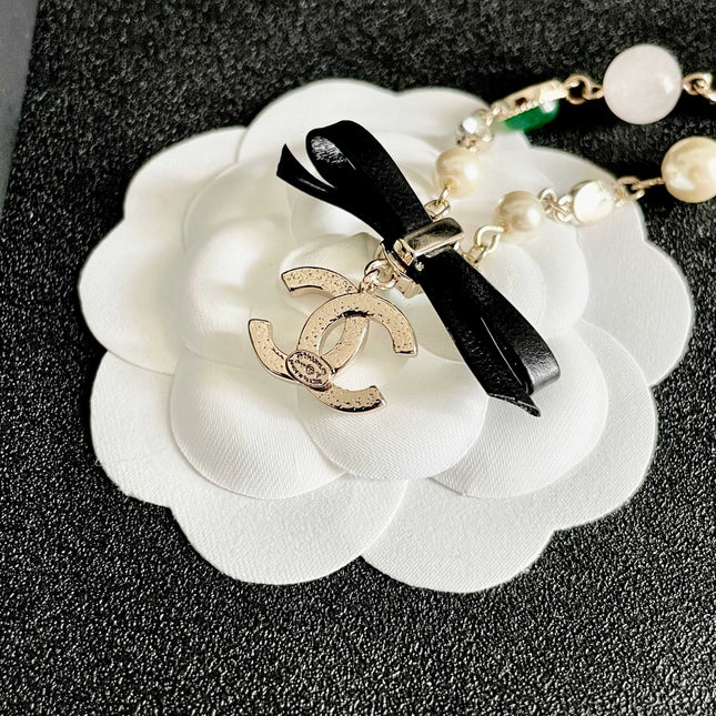 CHANEL 26S DOUBLE C LOGO MULTICOLOR GEMSTONE PEARL CHAIN BRACELET WITH CRYSTAL PENDANT IN GOLD METAL 629888