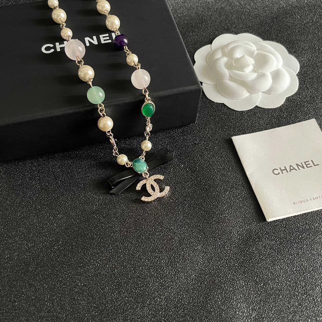 CHANEL 26S DOUBLE C LOGO MULTICOLOR GEMSTONE PEARL CHAIN BRACELET WITH CRYSTAL PENDANT IN GOLD METAL 629888