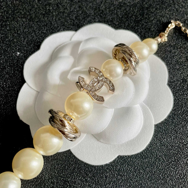 CHANEL 26S DOUBLE C LOGO PEARL BEADED BRACELET WITH CRYSTAL DETAIL IN GOLD METAL 631014