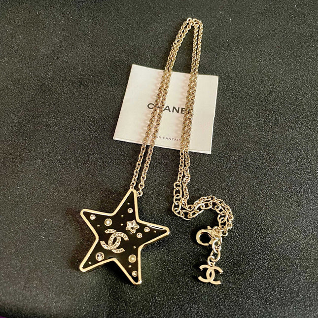 CHANEL 26S DOUBLE C LOGO BLACK ENAMEL STAR PENDANT NECKLACE WITH CRYSTAL DETAIL IN GOLD METAL 631015