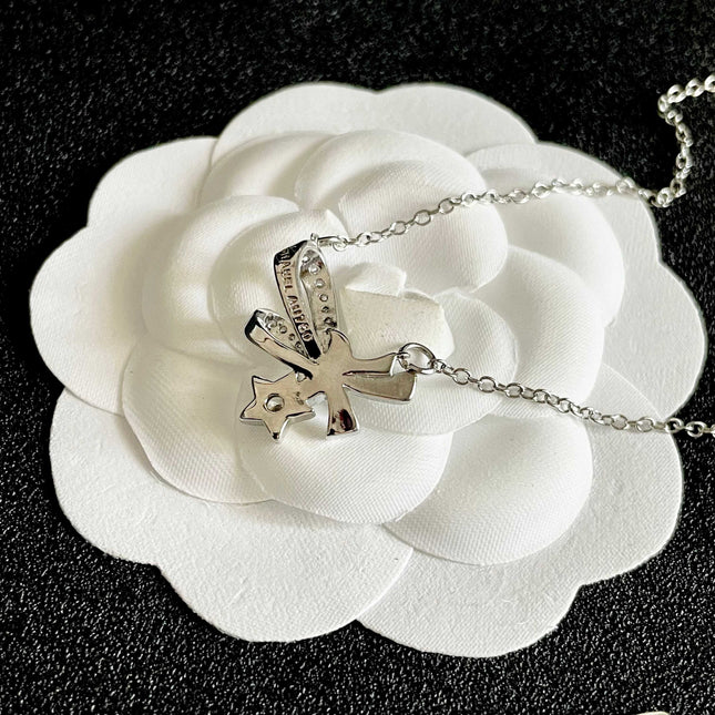 CHANEL 26S DOUBLE C LOGO CRYSTAL BOW & STAR PENDANT NECKLACE IN SILVER METAL 631019