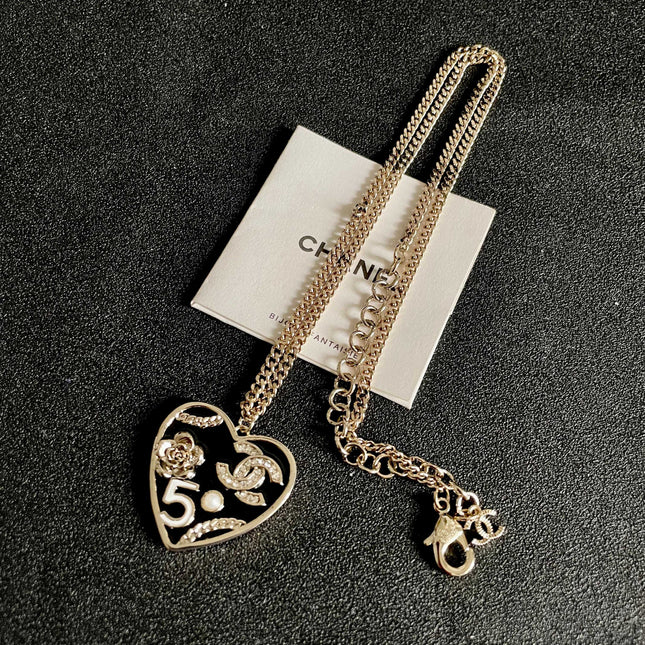 CHANEL 26S DOUBLE C LOGO HEART CHARM NECKLACE WITH NO.5 & FLORAL DETAIL IN GOLD METAL 630796